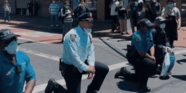 Police Officers Take a Knee in Solidarity With Protesters Amid George Floyd Unrest
