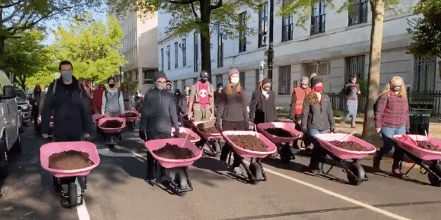 Climate Activists Dump Cow Poop at the White House To Protest Biden’s Climate Plan