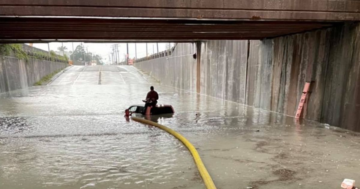 Firefighters Rescue Motorist from Floating Truck After Attempt to Drive Through Severely Flooded Underpass