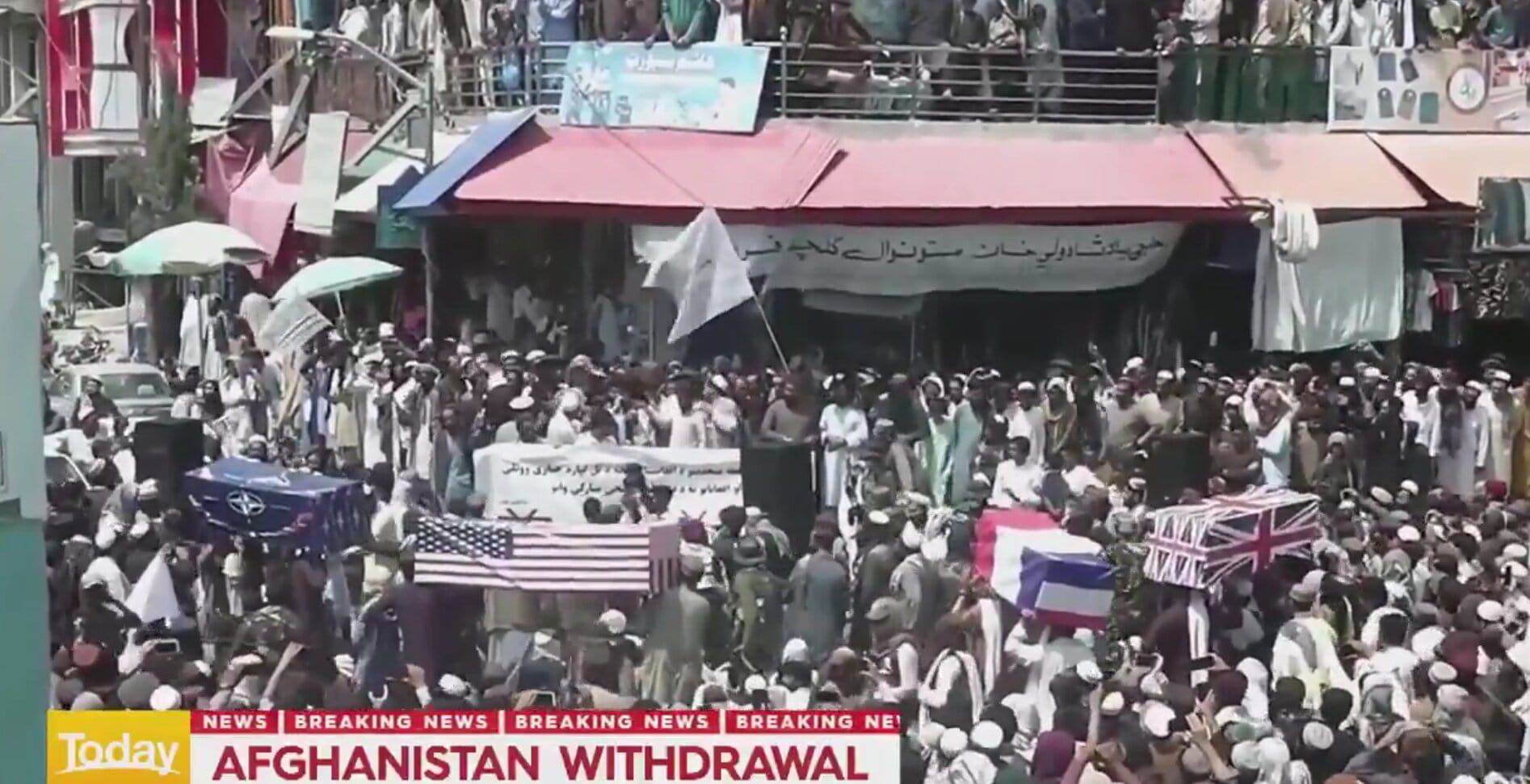 Taliban Supporters Carry Coffins Draped With American, NATO Flags During Mock Funeral