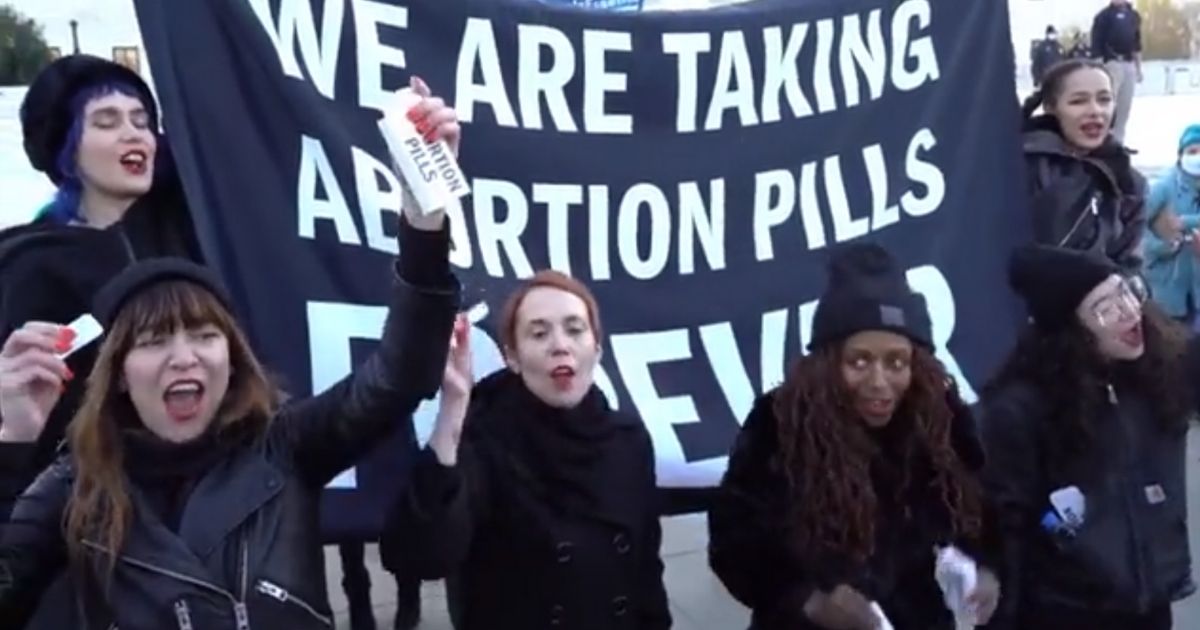 Women Proudly Take Abortion Pills Outside Supreme Court to Express Support for Killing Babies