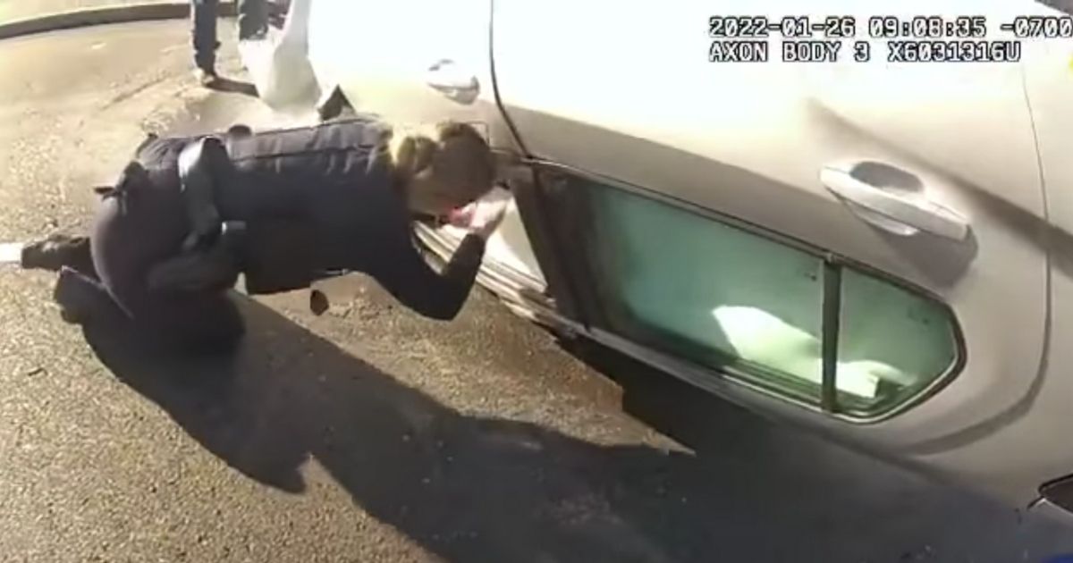 Two Officers Pull Unconscious Man from Flipped, Burning Car: 'I Just Need to Get This Guy Out'