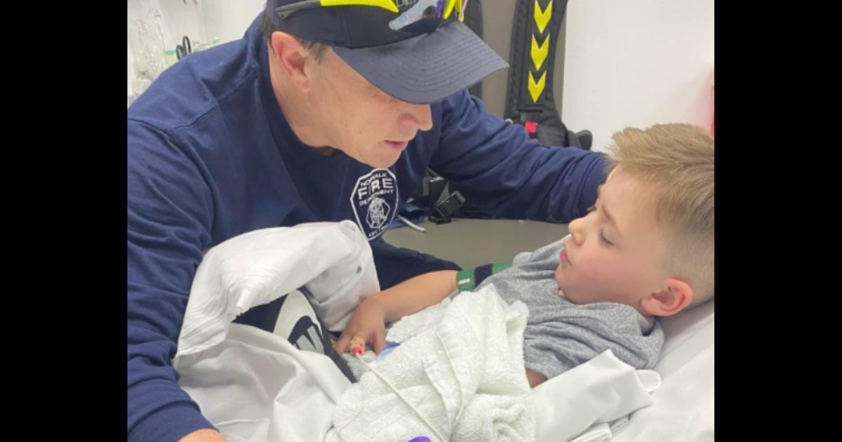 Boy Gets Stuck in Tube Slide and Breaks Arm: Firefighter Climbs in to Comfort Him While He's Treated