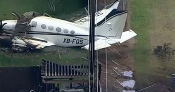Plane Slams Into Neighborhood, Barely Missing School, Homes and an Elderly Woman Sitting in Backyard Chair