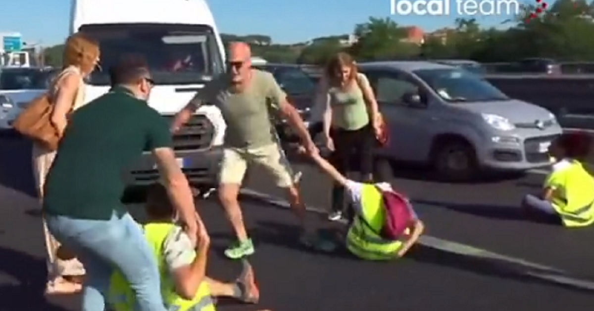 Video: Frustrated Drivers Blocked on Busy Road Take Matters Into Their Own Hands and Drag Protesters Out of the Way