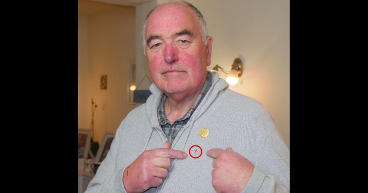 Derek Timms, a chaplain, was told he could not wear his cross pin.