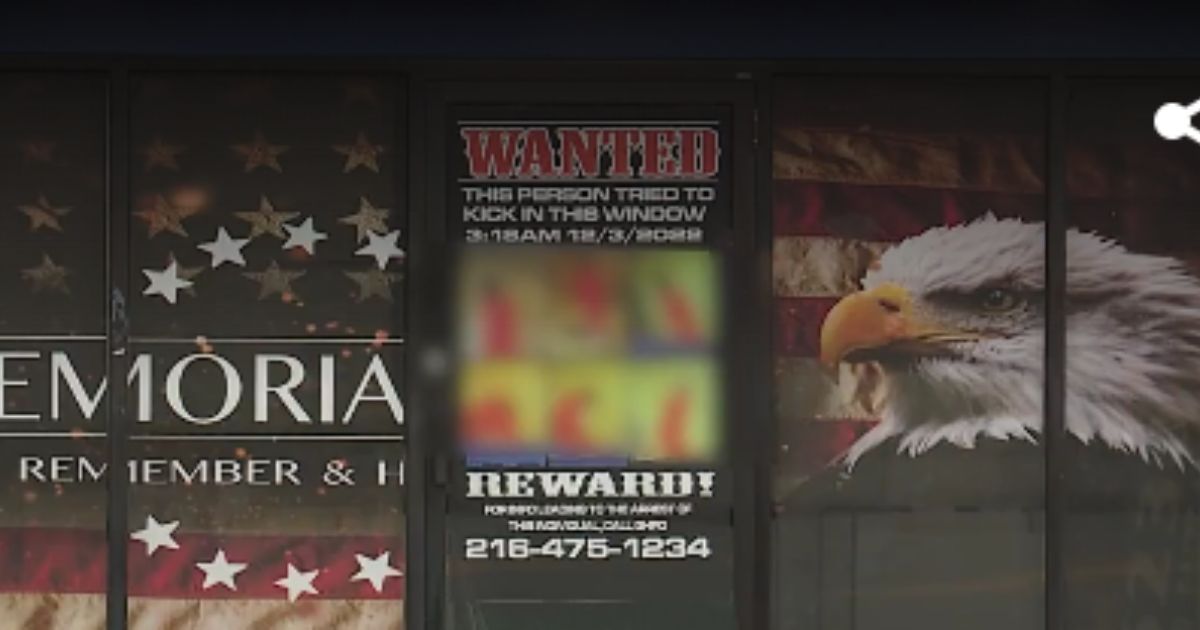 A store owner posted a wanted sign to try to find the individual who broke in.