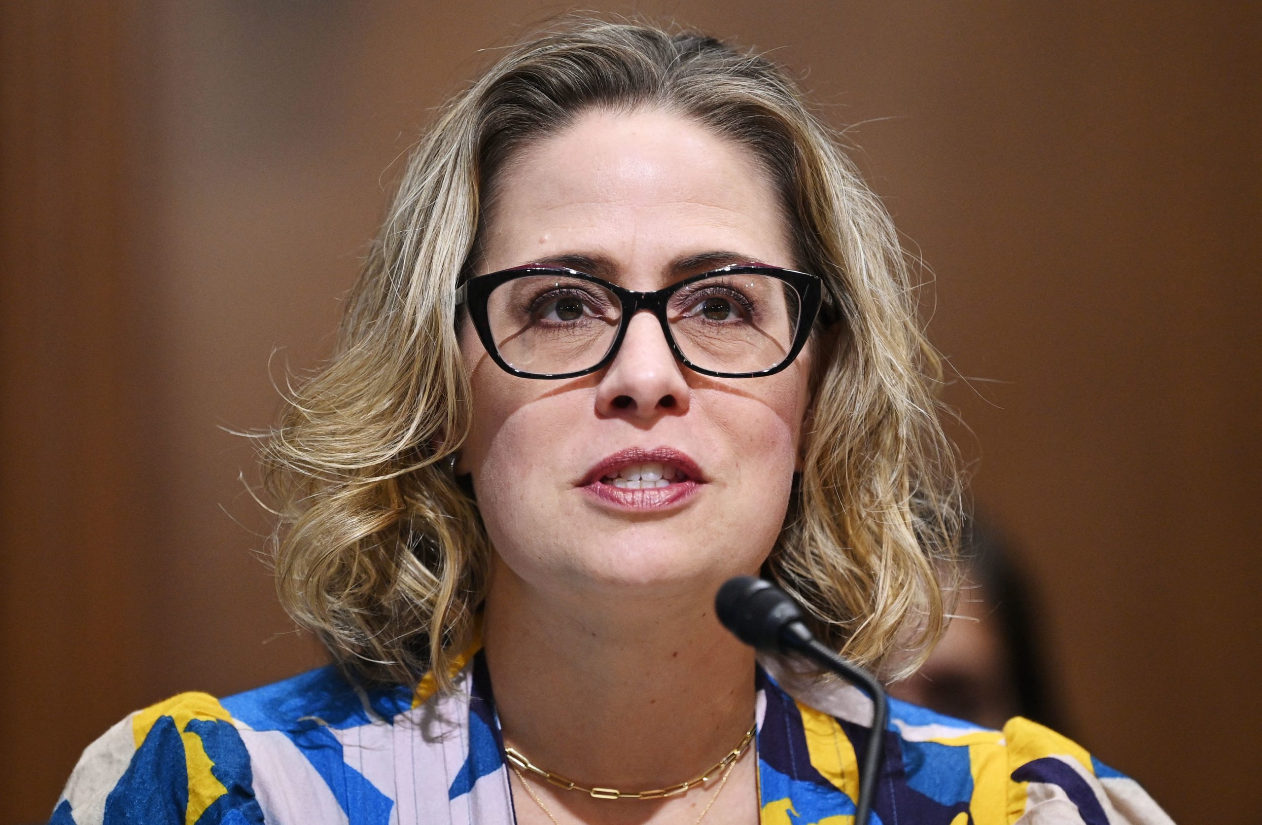 Kyrsten Sinema’s Outfit Mocked on Twitter: ‘A Bath Mat Is Not a Vest’