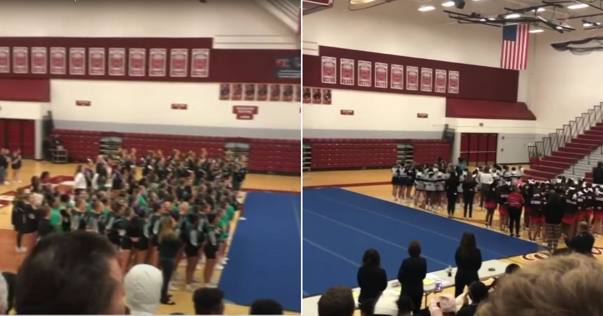 When the recording wouldn't play, the cheerleading teams joined together in singing the national anthem.