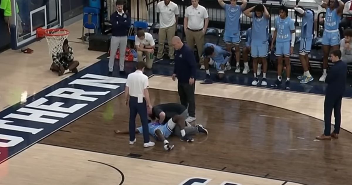 Old Dominion sophomore guard Imo Essien lies on the court after collapsing during a game against Georgia Southern.