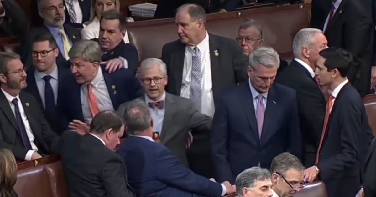 This screen shot depicts Rep. Mike Rogers as he has to be physically restrained from confronting Rep. Matt Gaetz.
