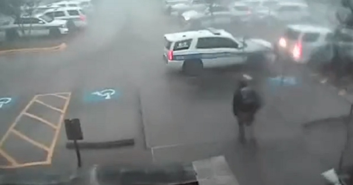 Surveillance video captures a Deer Park, Texas, police officer rushing to his SUV to get his service dog out of harm's way.