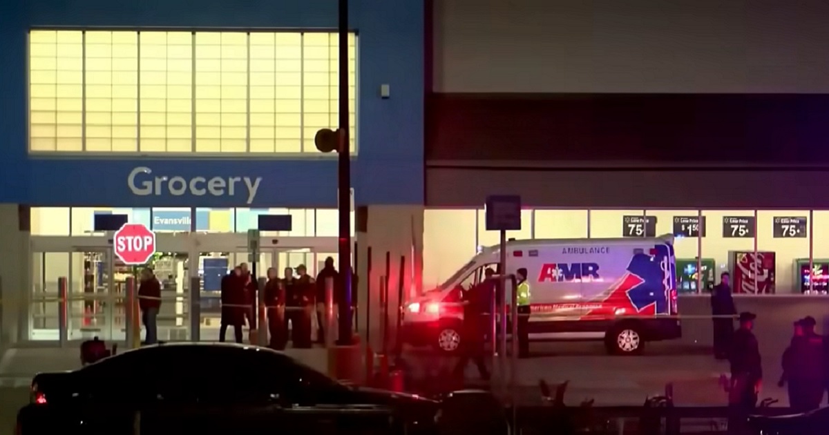Police and medical personnel are pictured outside a Walmart in Evansville, Indiana, late Thursday after a shooting.