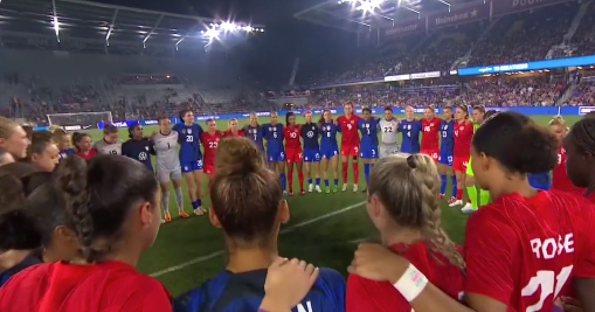 The U.S. and Canadian women's soccer teams joined together in a protest before a match in Orlando, Florida, on Thursday.