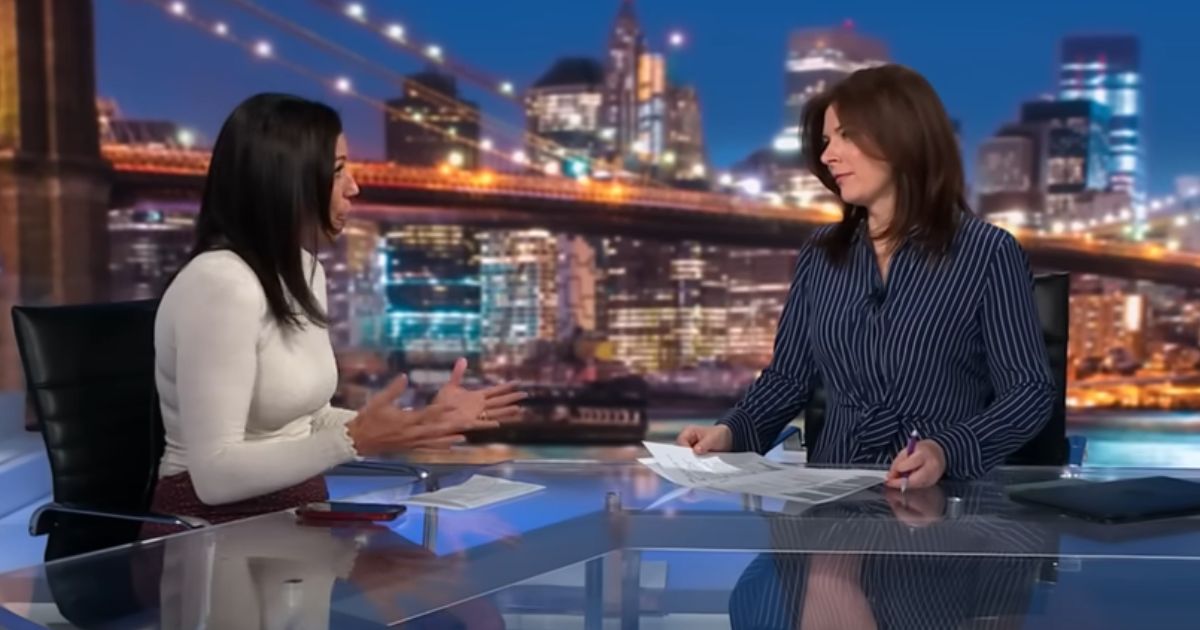 Brynn Gingras, left, talks to Erin Burnett during CNN's prime-time coverage Monday.
