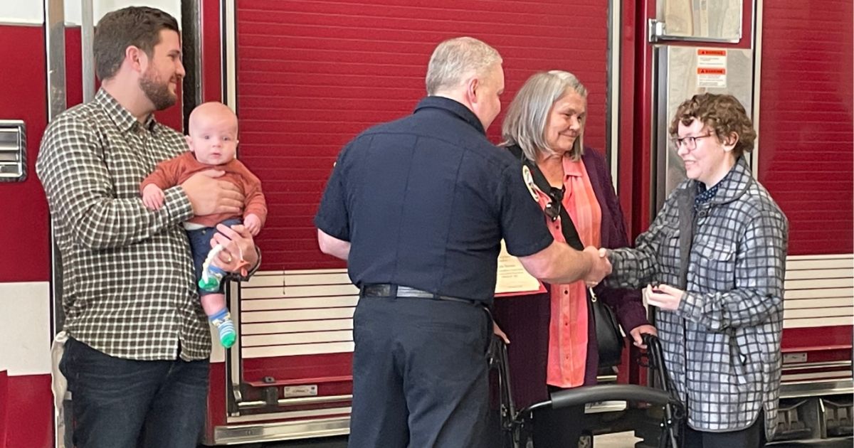 Kai Brown, right, and Ronnie Coulam, left, helped Jennie Brown, center, escape the fire.