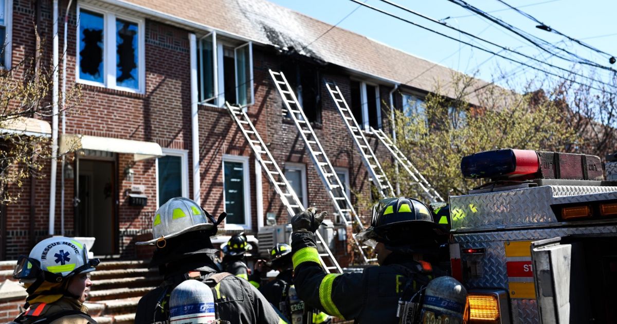 A 7-year-old boy and a 19-year-old girl were killed in the fire, which officials said blocked the front door.