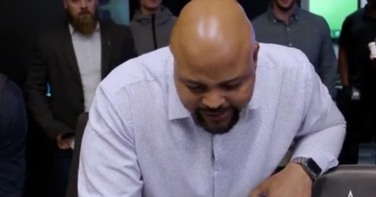 Chris Vaughn gets emotional while calling his son, Deuce Vaughn, to let him know that he was selected for the Dallas Cowboys.