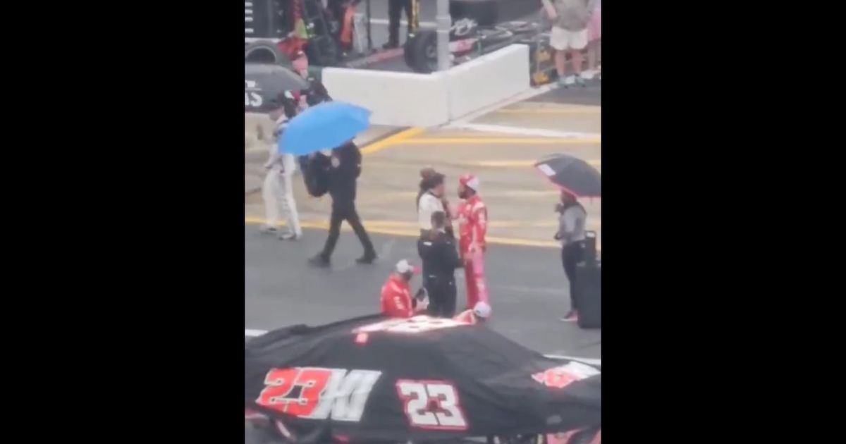 Aric Almirola and Bubba Wallace go face to face before Almirola shoved Wallace during a rain delay at the Coca-Cola 600 NASCAR race in North Carolina on Monday.
