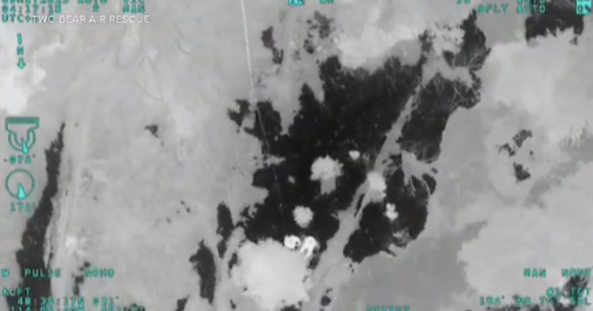 A video shows incredible footage of a missing hiker being rescued in Glacier National Park, Montana, on Monday night. (@DenverChannel / Twitter)