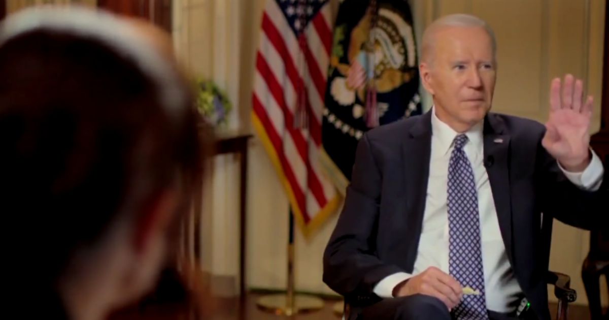 President Joe Biden gestures to a staffer who was trying to interrupt during an interview broadcast Friday with MSNBC's Stephanie Ruhle.