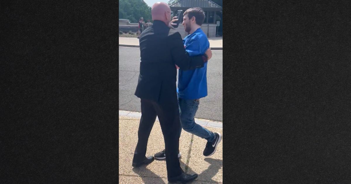Rep. Clay Higgins, a former Louisiana police officer, physically removed a protester from the scene.