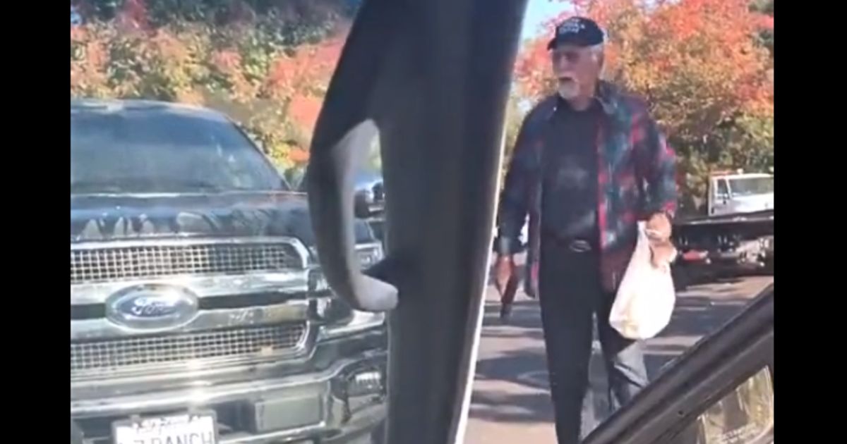 An armed driver responds to a prankster's live-stream antics. The prankster was pouring water from a gasoline can over vehicles.