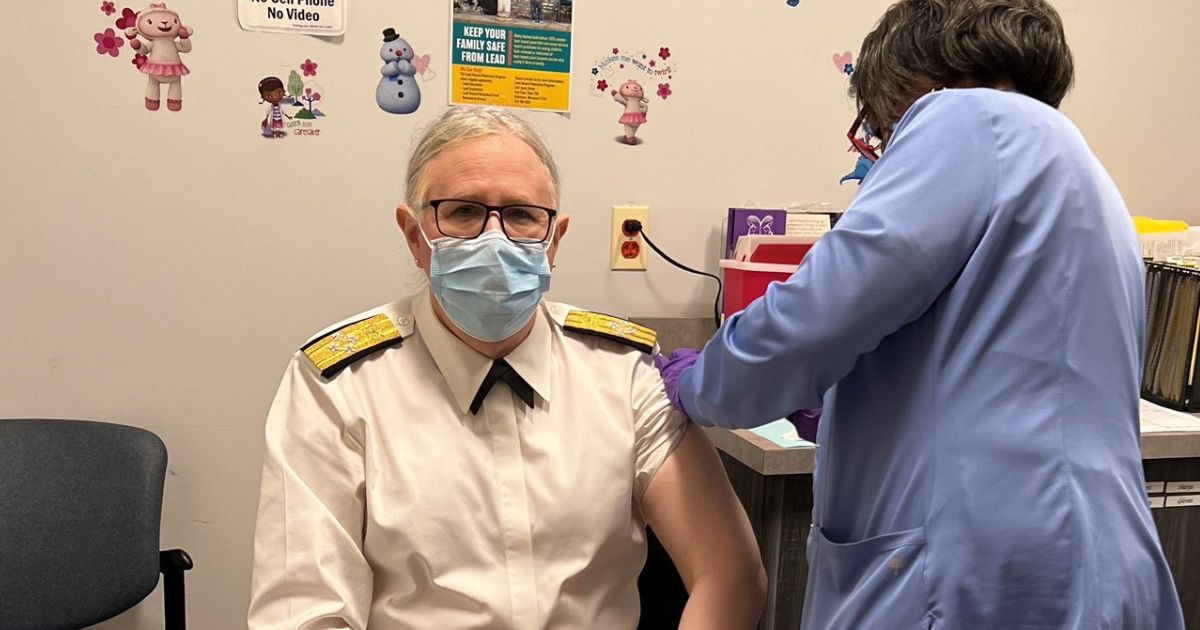 Rachel Levine seen receiving a booster shot.