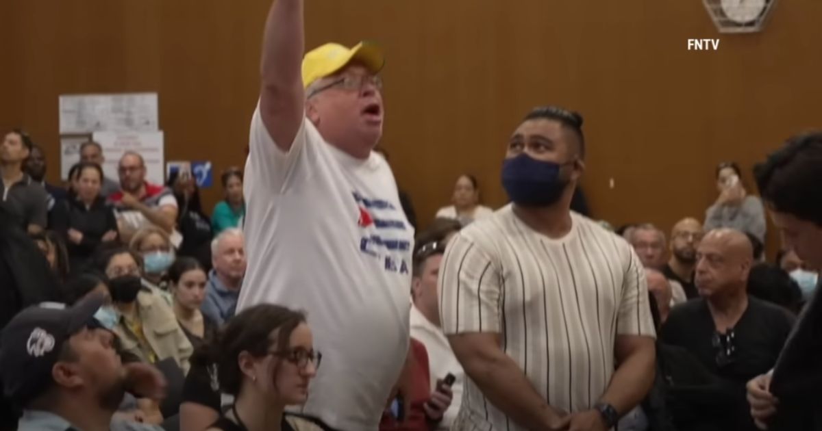 “American citizens before migrants,” one man yelled at New York Democratic Rep. Alexandria Ocasio-Cortez during a town hall in Queens on Friday.