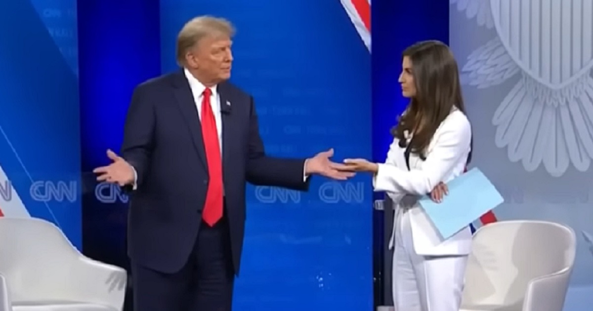 Former President Donald Trump, left, addresses CNN's Kaitlan Collins, right, during the Wednesday town hall.