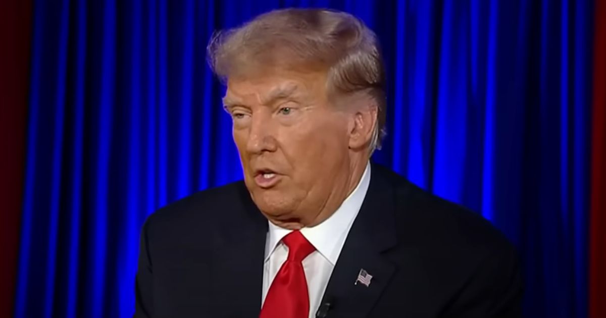 Former President Donald Trump speaks to Sean Hannity during a Fox News town hall Thursday.