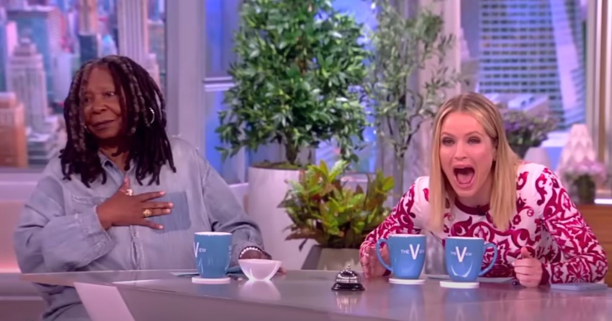 Sara Haines laughs at Whoopi Goldberg's slip-up on "The View" Tuesday.