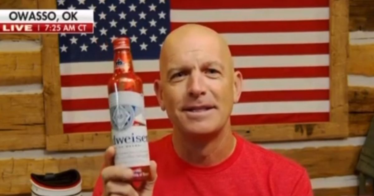 Folds of Honor founder Dan Rooney holds up a Budweiser can on Fox News' "Fox & Friends."