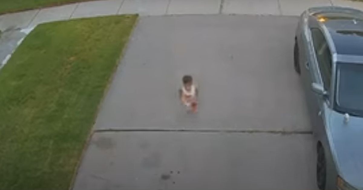 Toddler Maverick Flores runs into his home to alert his father, Johnathan Flores, of a car accident down the street at the request of his grandfather, Johnny Stobbs, in Corpus Christi, Texas, reported on Friday.