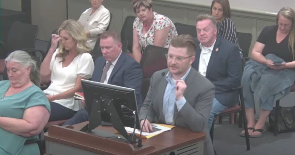 Benjamin Larrabee (at podium) set the school board straight with multiple examples of transgender individuals attacking girls.