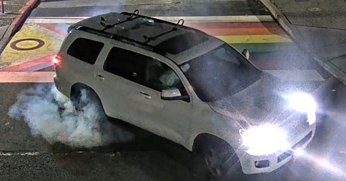This Twitter screen shot shows a vehicle driving over a 'pride' crosswalk.