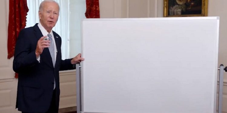 President Joe Biden stands in front of a whiteboard in a video released by the White House last week.