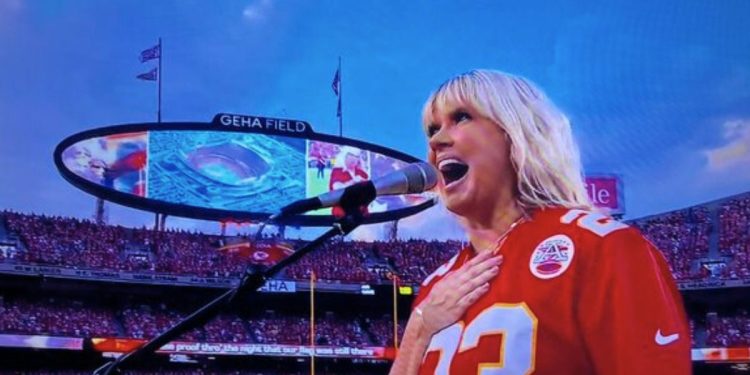 Christian artist Natalie Grant sings the national anthem before the NFL's season opener Thursday at Arrowhead Stadium in Kansas City.