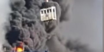 Crane Worker Saves Man Trapped Atop Burning Building