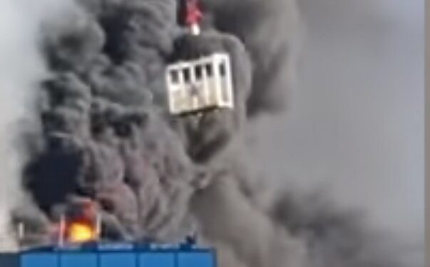 Crane Worker Saves Man Trapped Atop Burning Building