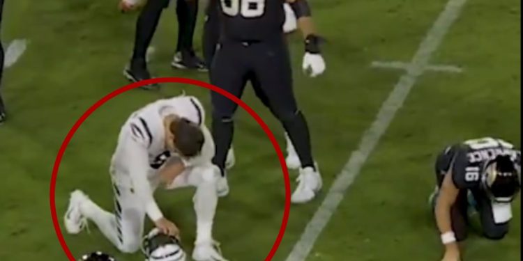 During Monday night's NFL game between the Cincinnati Bengals and Jacksonville Jaguars in Jacksonville, Florida, Bengals defensive end Trey Hendrickson got down to pray for injured Jaguars quarterback Trevor Lawrence.