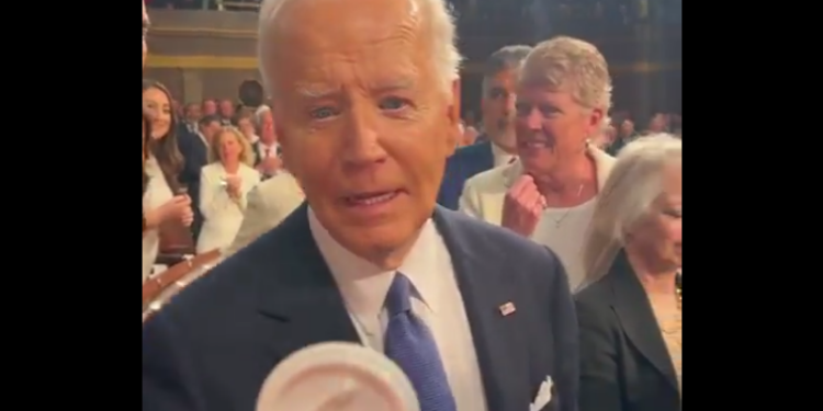 Marjorie Taylor Greene Confronts Biden as He Enters State of the Union, Hands Him a Button