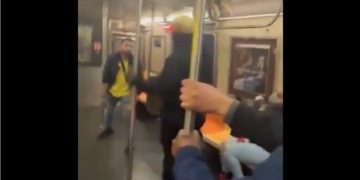 An attacker and victim square off in a subway fight Thursday in Brooklyn.