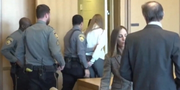 Former ESPN host Michelle Troconis is escorted from the courtroom Friday after being convicted in the murder of a woman in New Canaan, Connecticut, in 2019.