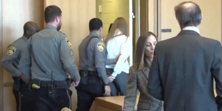 Former ESPN host Michelle Troconis is escorted from the courtroom Friday after being convicted in the murder of a woman in New Canaan, Connecticut, in 2019.