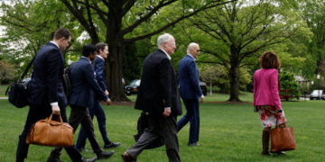 Biden Now Has Aides Walk With Him in Public to Distract From Stiff Gait: Report