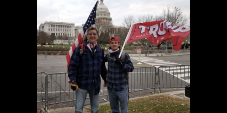 David Homol, left, and Dillon Homol, right, stand near the Capitol in Washington on Jan. 6, 2021.