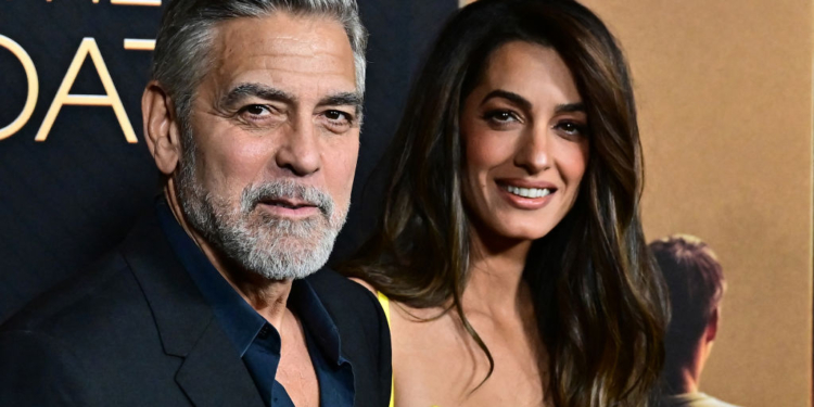 Clooney Defends Wife With Call to Biden Aide
