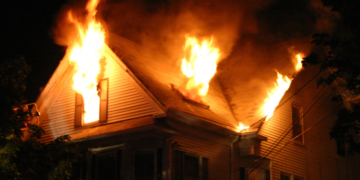 Man Shot by Police Inside Burning Home After Woman Found Dead, Others Rescued