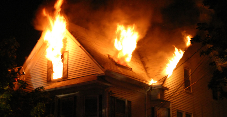 Man Shot by Police Inside Burning Home After Woman Found Dead, Others Rescued